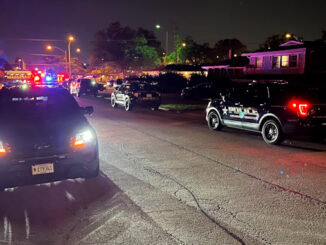 Arlington Heights Police Department SUVs filled the street in the neighbor near the intersection of Palatine Road and Eastwood Drive