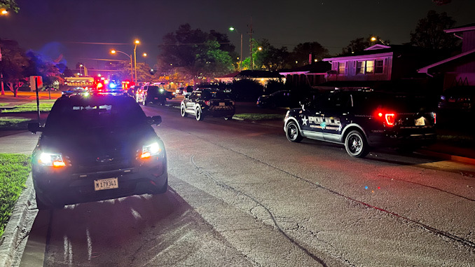 Arlington Heights Police Department SUVs filled the street in the neighbor near the intersection of Palatine Road and Eastwood Drive