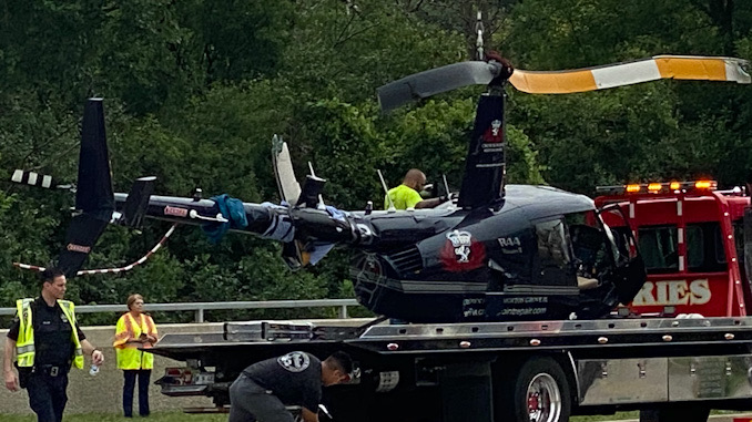 Helicopter after it was lifted on a Fries flatbed truck