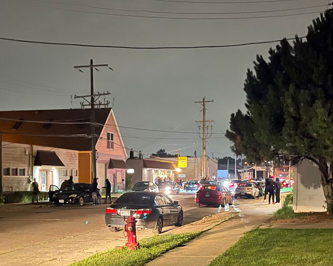 Gathering at Knights of Columbus The KC Hall spilling out onto Hickory Avenue in Arlington Heights on Sunday, August 1, 2021 about 11:00 p.m.