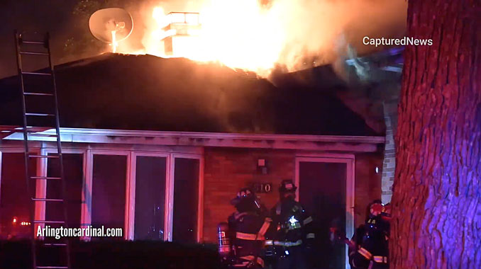 House fire on Mark Drive in Mount Prospect with fire through the roof