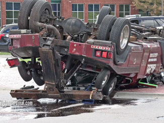 Rollover tow truck crash in Schaumburg at Plum Grove Road and East State Parkway