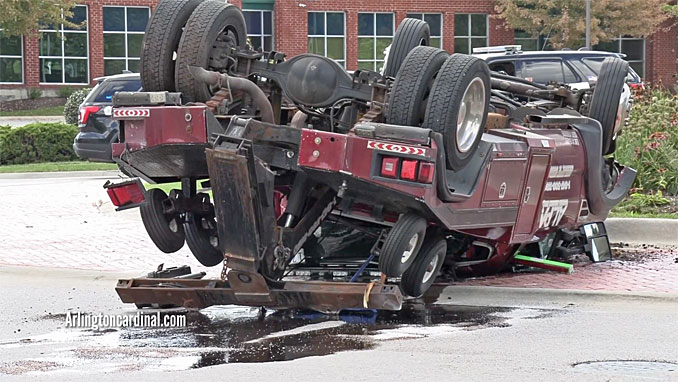 Rollover tow truck crash in Schaumburg at Plum Grove Road and East State Parkway