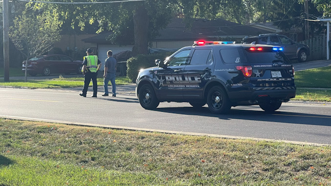 Arlington Heights police officers working at the scene of a hit-and-run pedestrian crash at Thomas Street and Hickory Avenue in Arlington Heights