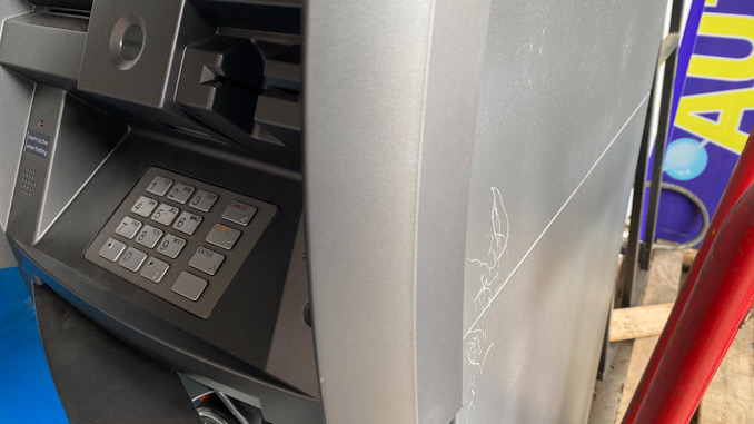 ATM damaged at Northwest Auto Wash after it was damaged and replaced