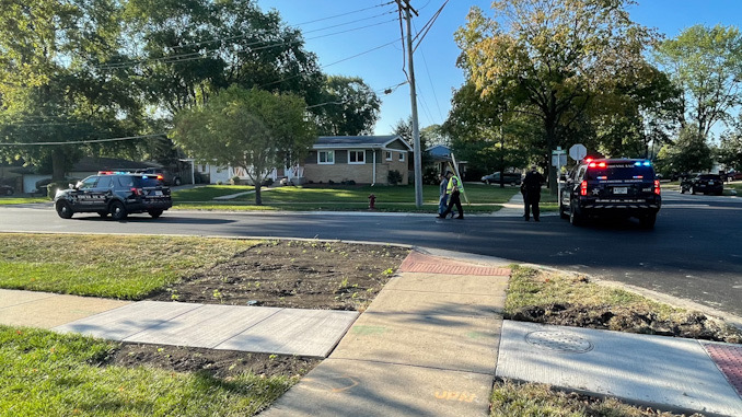 Arlington Heights police officers working at the scene of a hit-and-run pedestrian crash at Thomas Street and Hickory Avenue in Arlington Heights