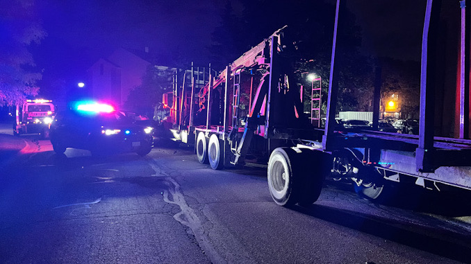 Black Toyota 4Runner crash into a Mack Truck