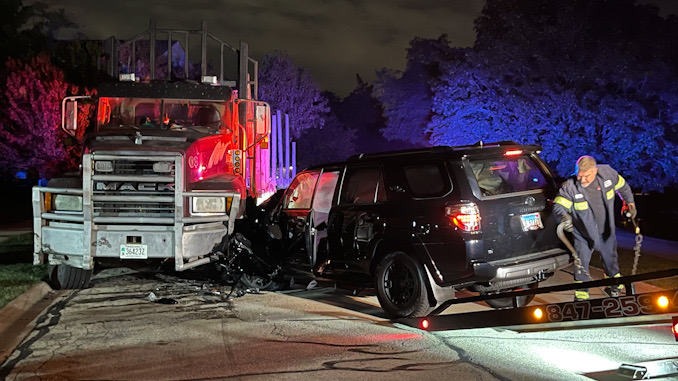 Black Toyota 4Runner crash into a Mack Truck