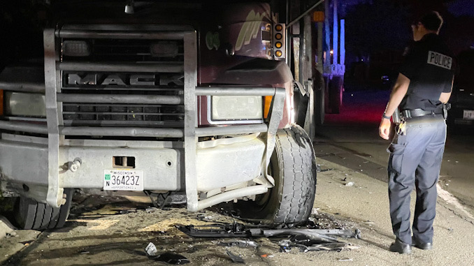 Black Toyota 4Runner crash into a Mack Truck