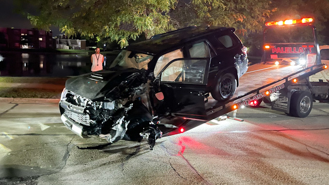 Black Toyota 4Runner crash into a Mack Truck
