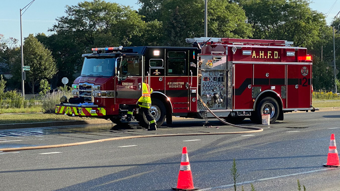 Arlington Heights Fire Department Engine 2 crew standing by with a charged line