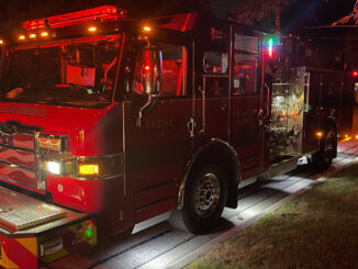 Arlington Heights Fire Department Engine 2 on the scene at the street while crew work on ventilating Carbon Monoxide from a home in Arlington Heights