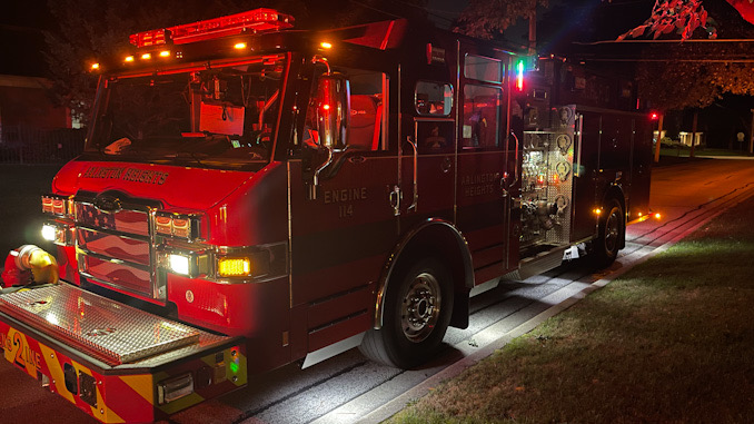 Arlington Heights Fire Department Engine 2 on the scene at the street while crew work on ventilating Carbon Monoxide from a home in Arlington Heights