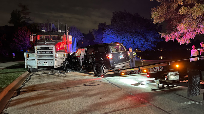 Black Toyota 4Runner crash into a Mack Truck