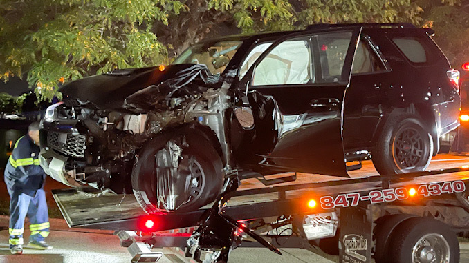 Black Toyota 4Runner crash into a Mack Truck