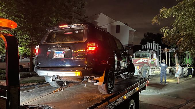 Black Toyota 4Runner crash into a Mack Truck