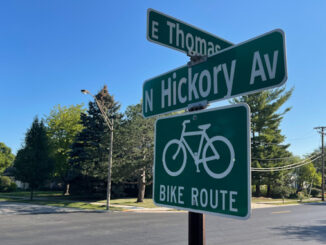 Street sign at Thomas Street and Hickory Avenue where a woman was seriously injured as a pedestrian in a hit-and-run crash