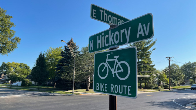 Street sign at Thomas Street and Hickory Avenue where a woman was seriously injured as a pedestrian in a hit-and-run crash