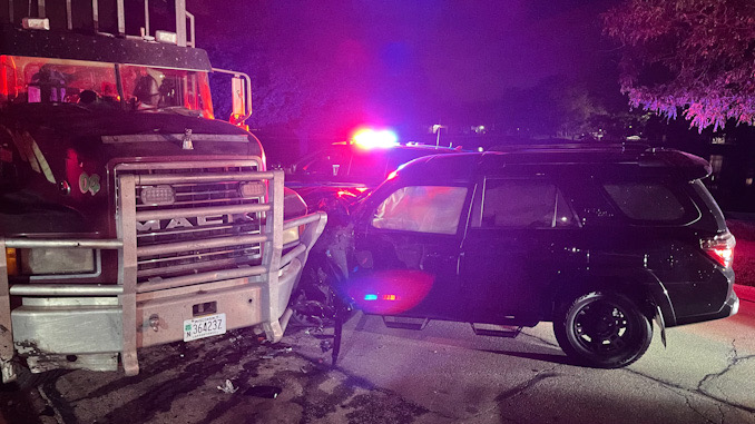 Black Toyota 4Runner crash into a Mack Truck