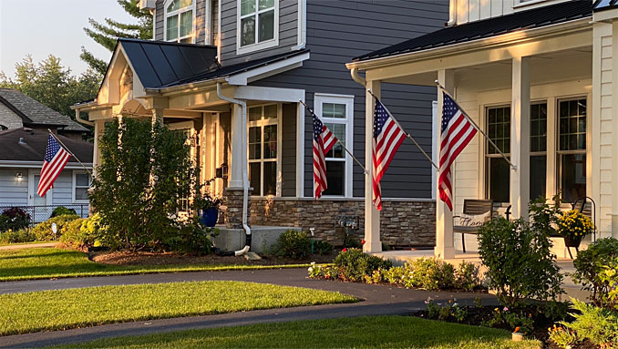 US flags at two house in Arlington Heights on September 11, 2021
