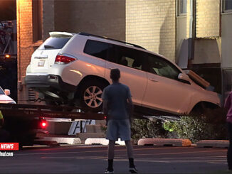 Toyota Highlander removed from church building at the First Baptist Church of Arlington Heights on Campbell Street