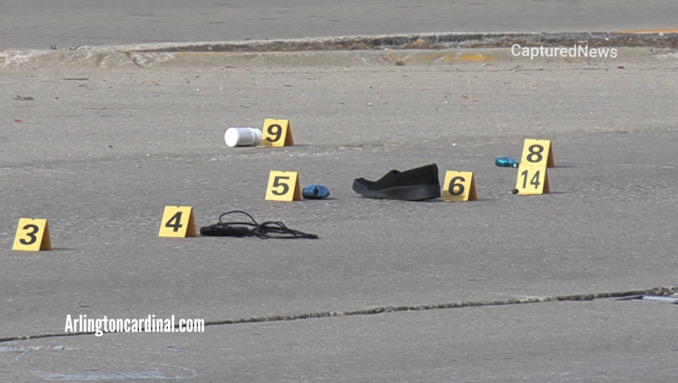 Evidence markers at the scene of a fatal hit-and-run crash on Higgins Road west of Elmhurst Road in Elk Grove Village Wednesday, October 13, 2021