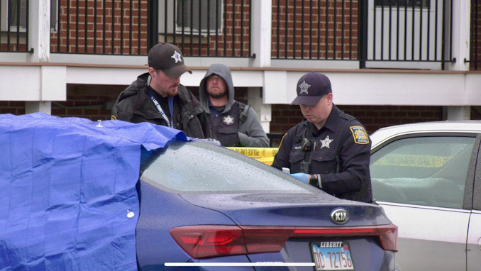 Crime scene around a blue Kia sedan at the scene of a fatal shooting in Park City (SOURCE: Craig/CapturedNews)