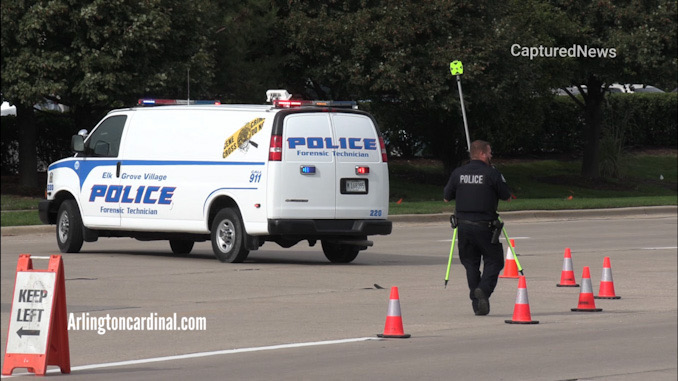 Crash investigators at the scene of a fatal hit-and-run crash on Higgins Road west of Elmhurst Road in Elk Grove Village Wednesday, October 13, 2021.