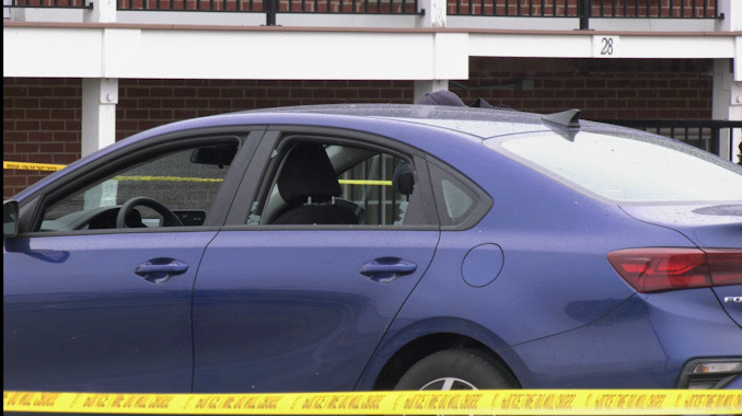 Evidence markers near a blue Kia sedan at the scene of a fatal shooting in Park City (SOURCE: Craig/CapturedNews)