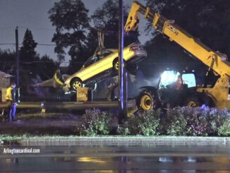 Car lifted off railroad tracks by Hillside Towing using JCB Telehandler construction east of Mount Prospect Road