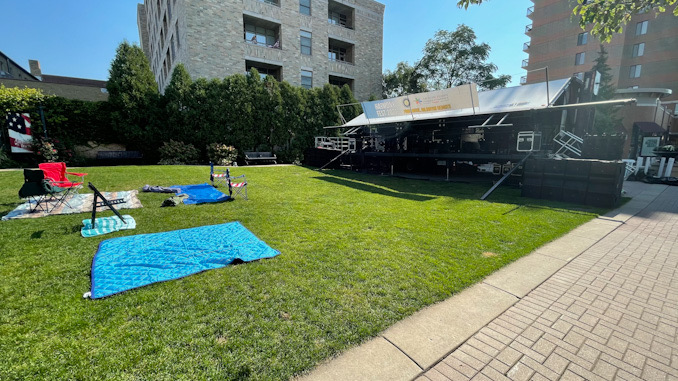 Oops. Saving seats with blankets, tarps, or chairs in Harmony Park is not permitted