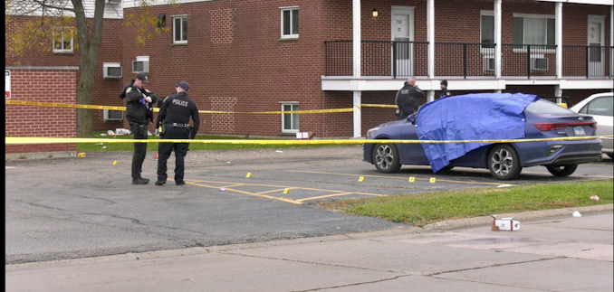 Crime scene around a blue Kia sedan at the scene of a fatal shooting in Park City (SOURCE: Craig/CapturedNews)
