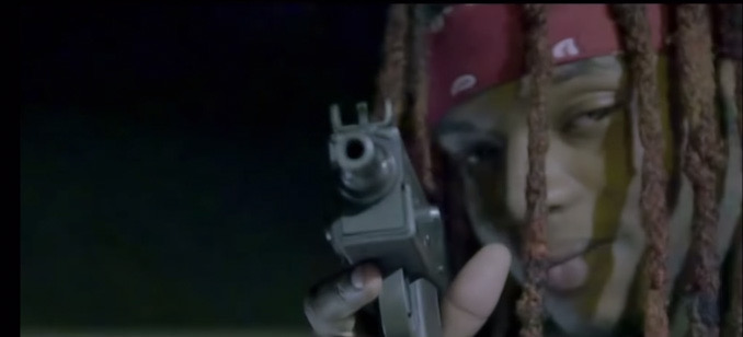 Still frame in rap video showing the only other character in the video armed with a weapon