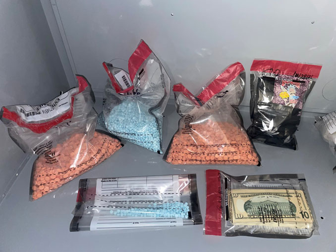 Drug packages and cash (SOURCE: Kane County Sheriff's Office)