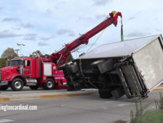 Hillside Towing rotator crane lifts and uprights an Enterprise box truck that was involved in a crash at Dundee Road and Kennicott Road in Arlington Heights