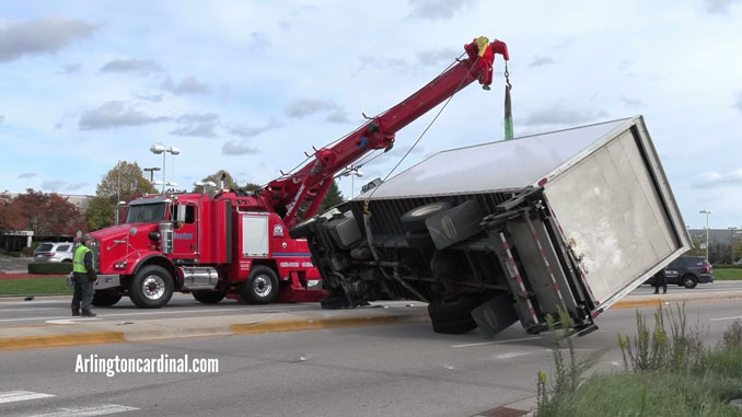 Hillside Towing rotator crane lifts and uprights an Enterprise box truck that was involved in a crash at Dundee Road and Kennicott Road in Arlington Heights