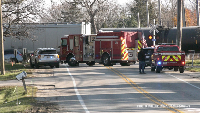 Minivan pushed to the left by a freight train traveling southwest on the Canadian National Railway at Gilmer Road near Mundelein