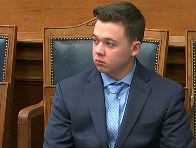 Kyle Rittenhouse listens to Defense Attorney Mark Richards during closing arguments on Monday, November 15, 2021