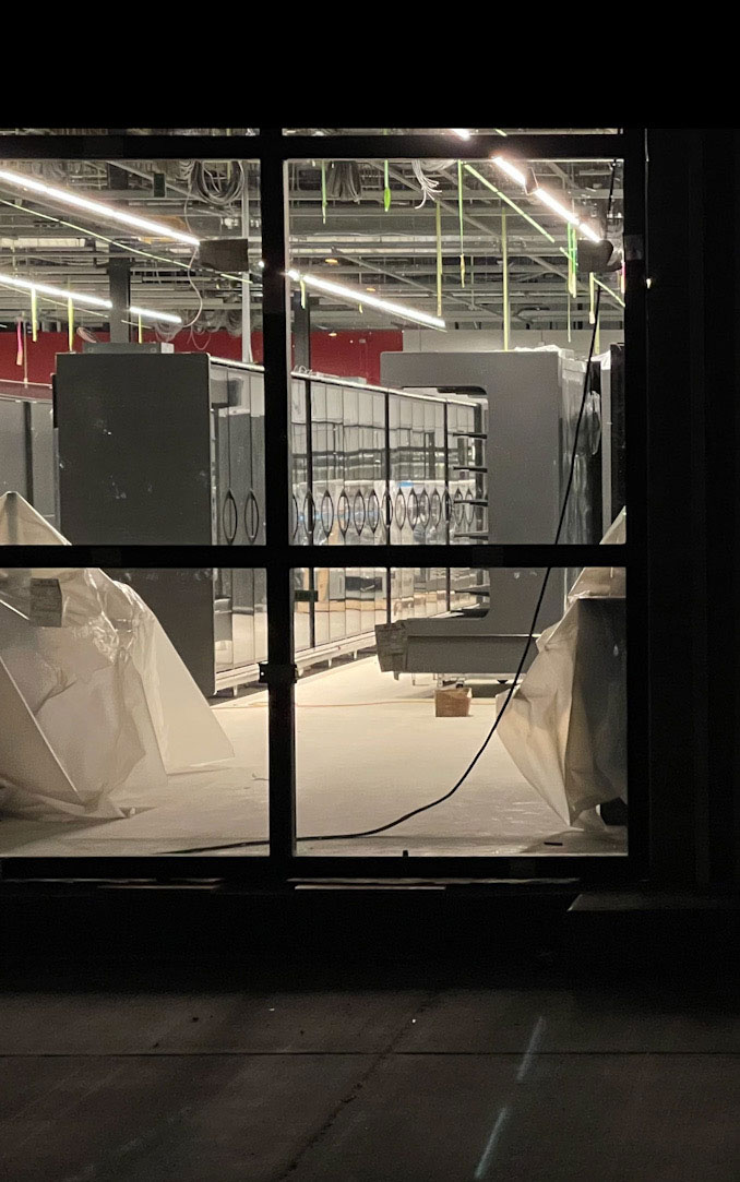 Upright foods cases with glass doors, newly installed at the Amazon Fresh store in Arlington Heights at 325 East Palatine Road