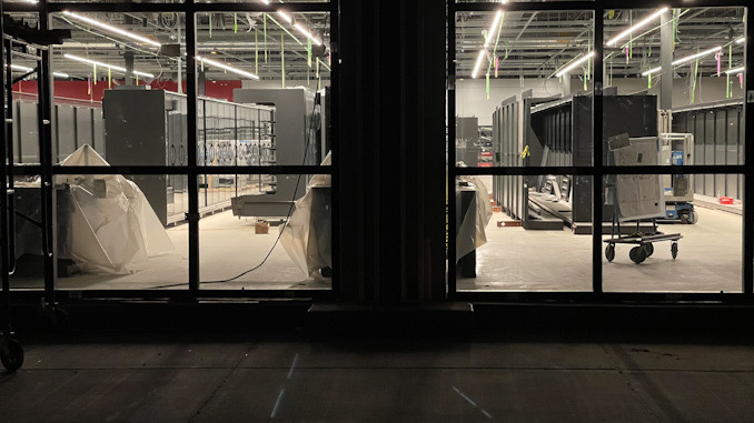 Upright foods cases with glass doors, newly installed at the Amazon Fresh store in Arlington Heights at 325 East Palatine Road