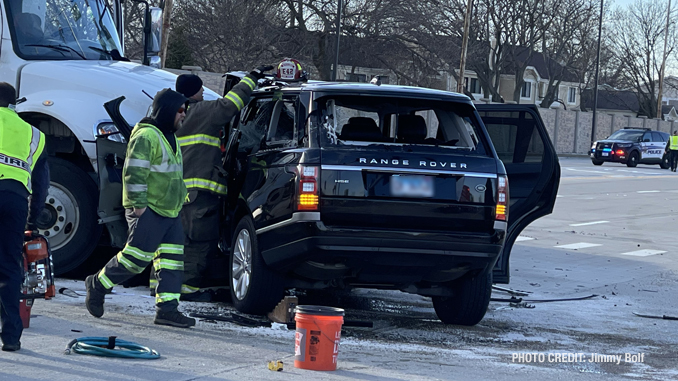 Intersection crash involving a semi-trailer truck and a black Range Rover SUV at Lake Cook Road and Lexington Drive in Wheeling (PHOTO CREDIT: Jimmy Bolf)