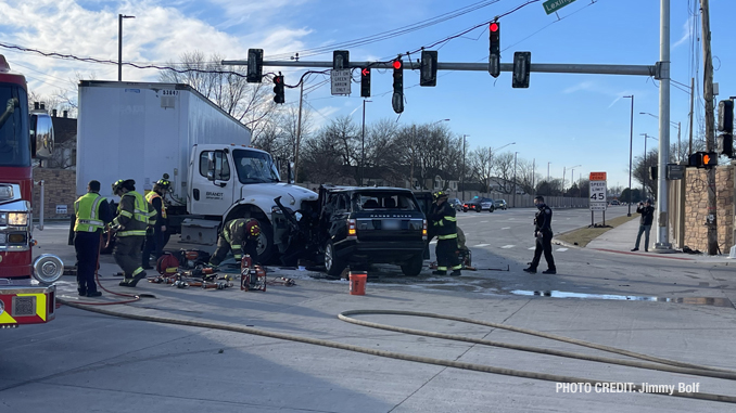 Intersection crash involving a semi-trailer truck and a black Range Rover SUV at Lake Cook Road and Lexington Drive in Wheeling (PHOTO CREDIT: Jimmy Bolf).