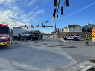 Intersection crash involving a semi-trailer truck and a black Range Rover SUV at Lake Cook Road and Lexington Drive in Wheeling (PHOTO CREDIT: Jimmy Bolf)