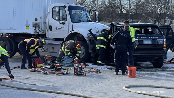 Intersection crash involving a semi-trailer truck and a black Range Rover SUV at Lake Cook Road and Lexington Drive in Wheeling (PHOTO CREDIT: Jimmy Bolf)