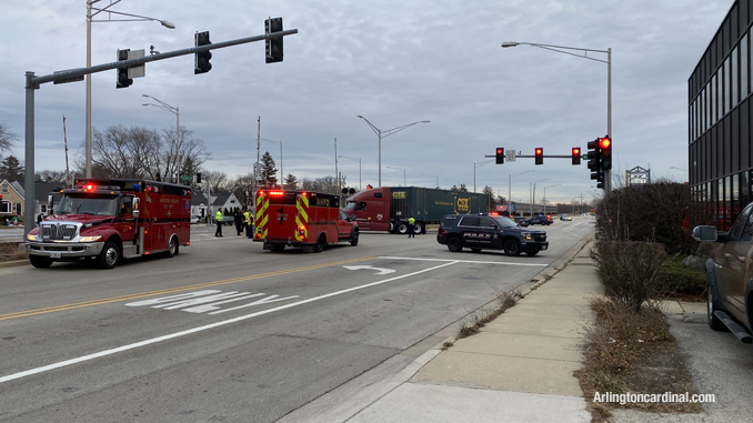 A semi-trailer truck backs off of the UP Northwest line railroad tracks at Arthur, Davis, US 14 grade crossing Wednesday afternoon, December 22, 2021