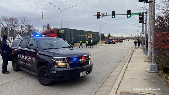 A semi-trailer truck backs off of the UP Northwest line railroad tracks at Arthur, Davis, US 14 grade crossing Wednesday afternoon, December 22, 2021 (PHOTO CREDIT: CARDINAL NEWS)