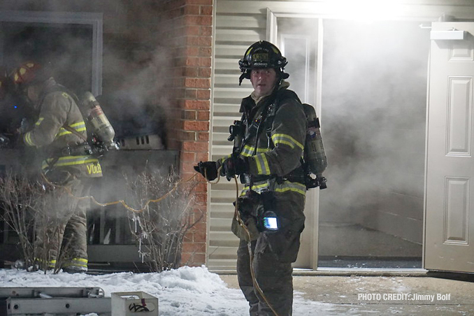 Firefighters work on ventilating an 8-unit condo building on Darlington Lane in Crystal Lake (PHOTO CREDIT: Jimmy Bolf)