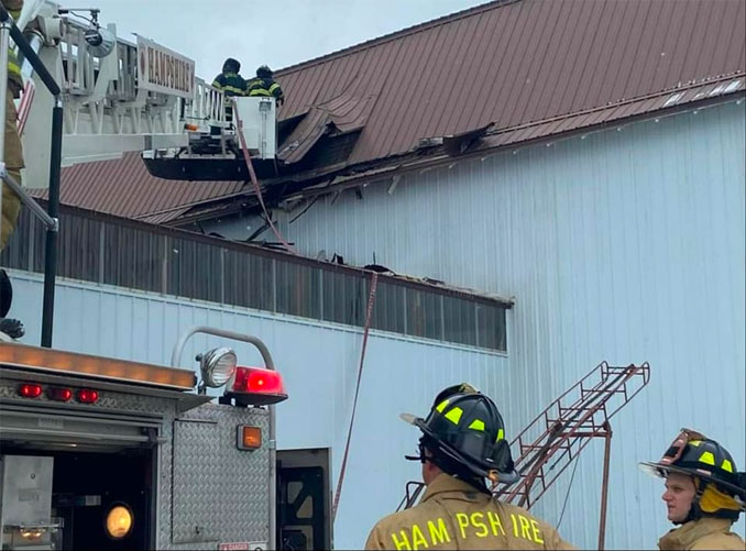 Hampshire firefighters inspecting warehouse structure after explosion inside (SOURCE: Hampshire Fire Protection District)