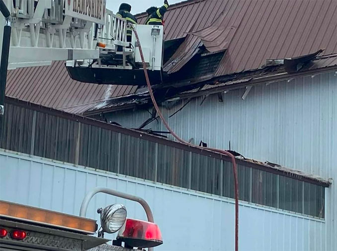 Hampshire firefighters inspecting warehouse structure after explosion inside (SOURCE: Hampshire Fire Protection District)