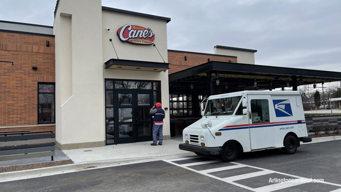 Front entrance with outdoor dining area at Raising Cane's, 225 East Palatine Road in Arlington Heights